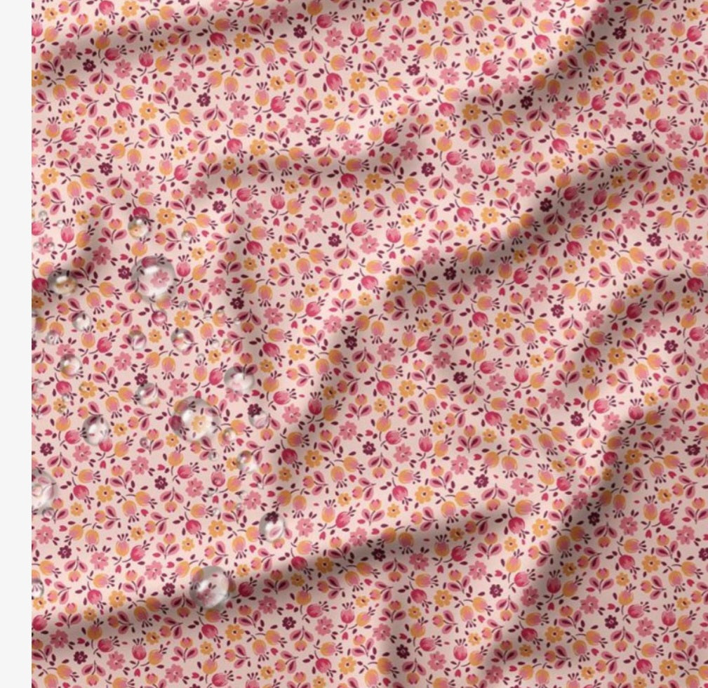 TISSU IMPERMEABLE FLEURI ROSE ET ORANGE